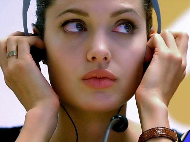 Woman Wearing Headphones — Brown, Focused