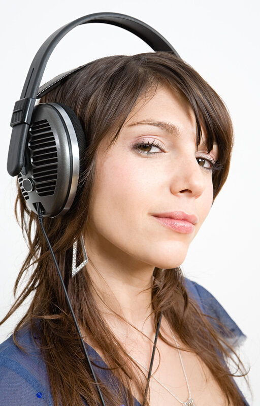 Woman Wearing Headphones — Brown, Neutral, Photograph