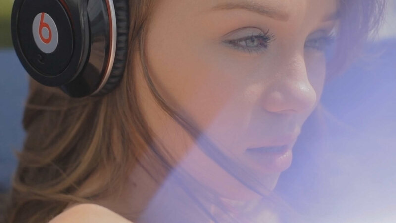 Woman Wearing Headphones — Brown
