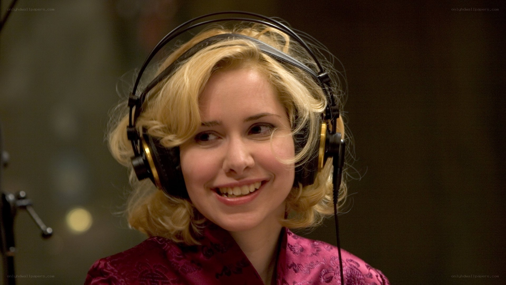 woman wearing headphones smiling