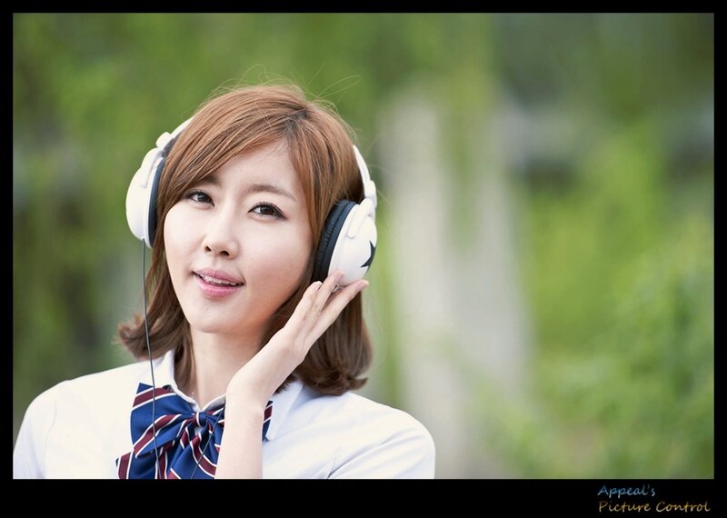 Woman Wearing Headphones — White, Calm, Afternoon, Photograph