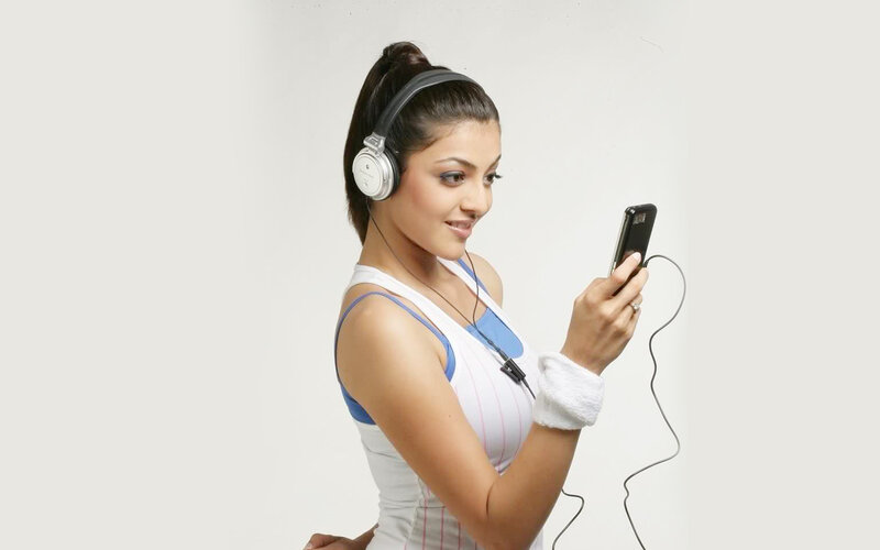 Woman Wearing Headphones — White, Focused, Photograph
