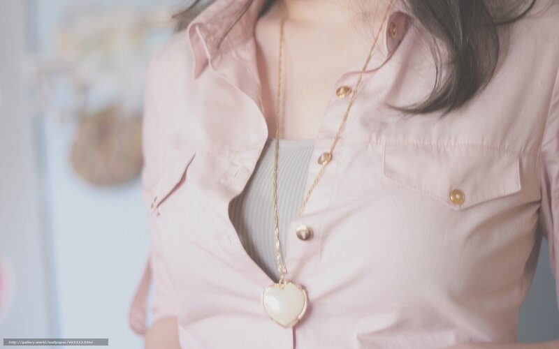 woman wearing heart necklace