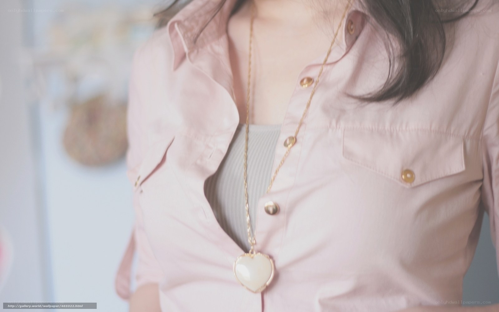 woman wearing heart necklace