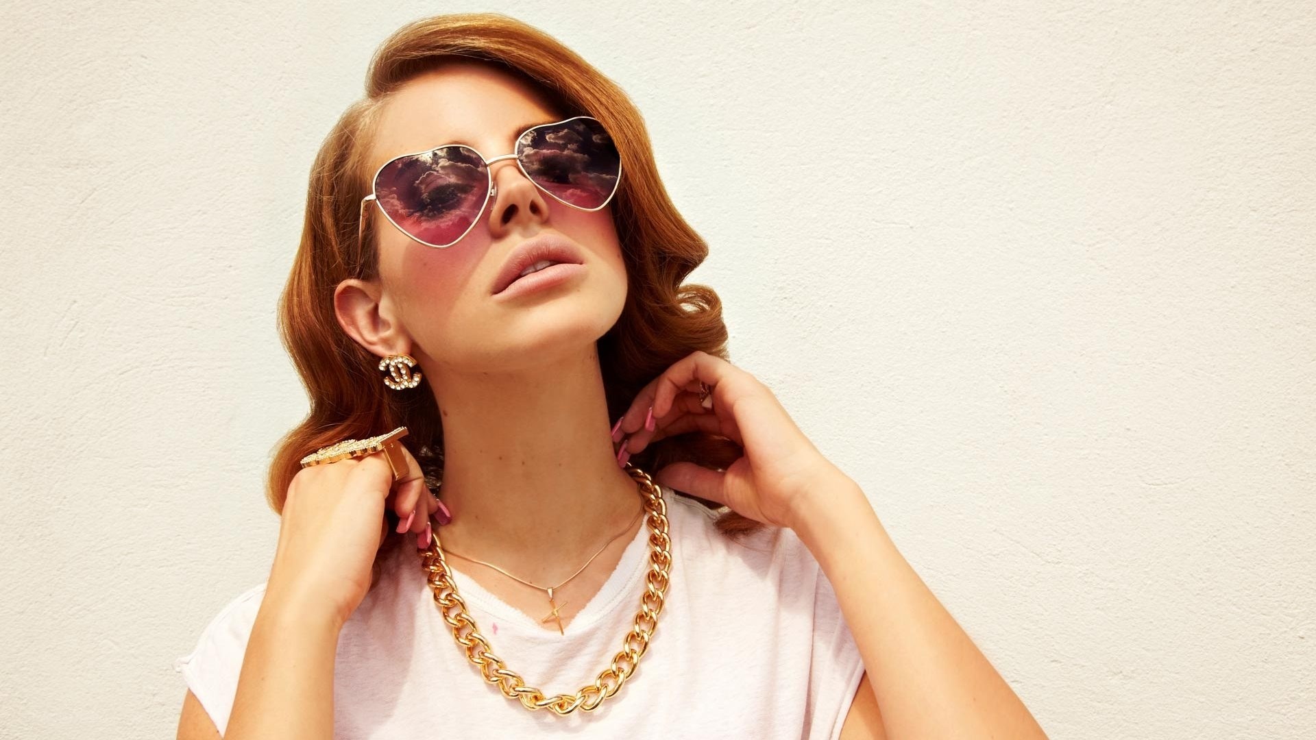 woman wearing heart sunglasses