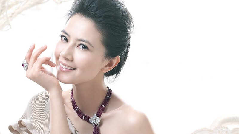 woman wearing jewelry smiling