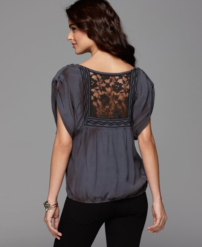 woman wearing lace-back top