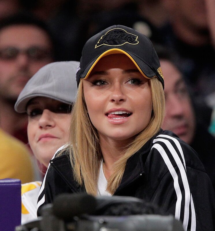 woman wearing lakers cap