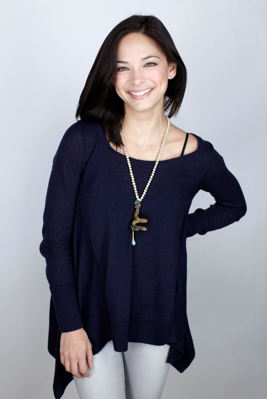 woman wearing navy sweater