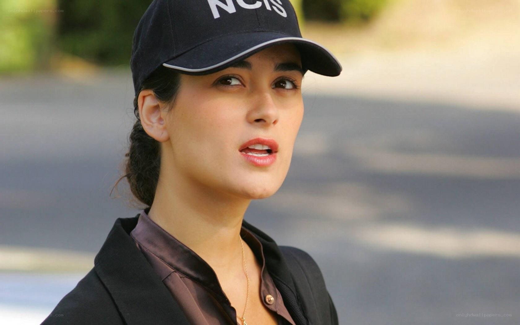 woman wearing ncis cap
