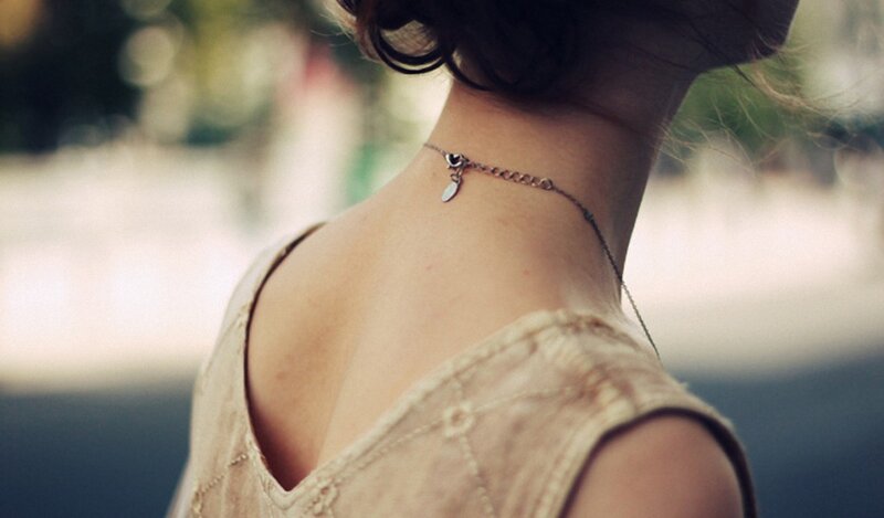 woman wearing necklace from behind