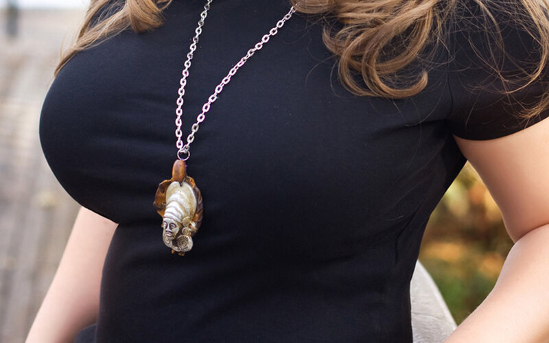 woman wearing pendant necklace