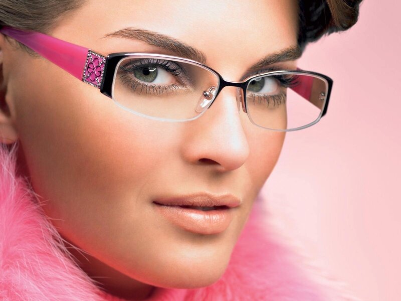 woman wearing pink glasses