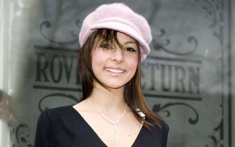 Woman Wearing Pink Hat — Smiling