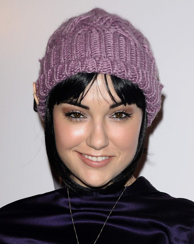 woman wearing purple beanie