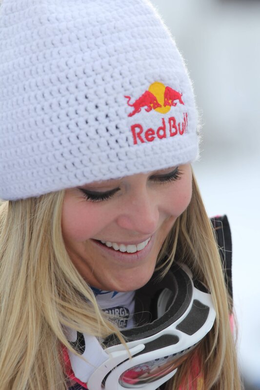 woman wearing red bull beanie
