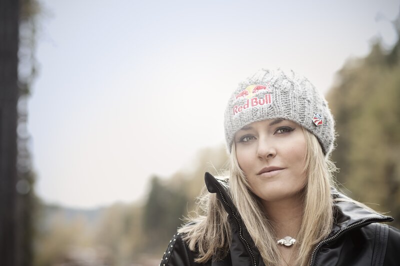woman wearing red bull hat