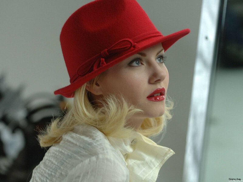 Woman Wearing Red Hat — Contemplative