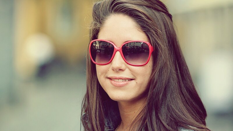 woman wearing red sunglasses
