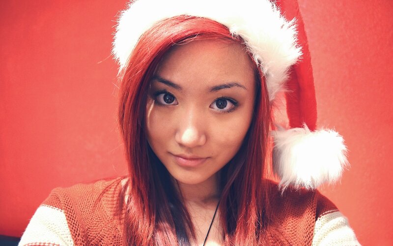 Woman Wearing Santa Hat — Red, Festive, Photograph