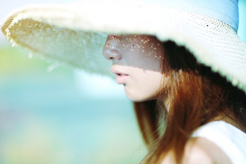 Woman Wearing Straw Hat — Blue, Serene
