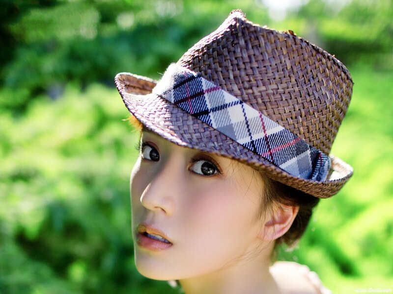 Woman Wearing Straw Hat — Green