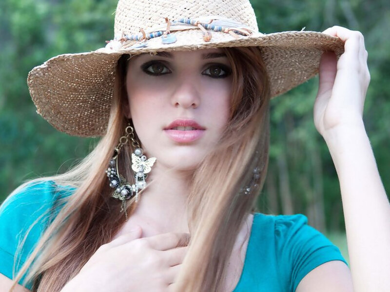 Woman Wearing Straw Hat — Teal