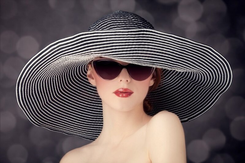 Woman Wearing Sun Hat — Black, Dramatic, Photograph