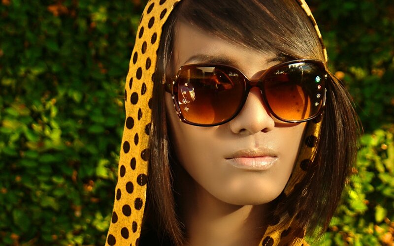 woman wearing sunglasses and headscarf