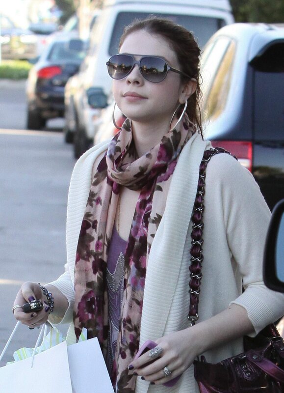 woman wearing sunglasses and scarf