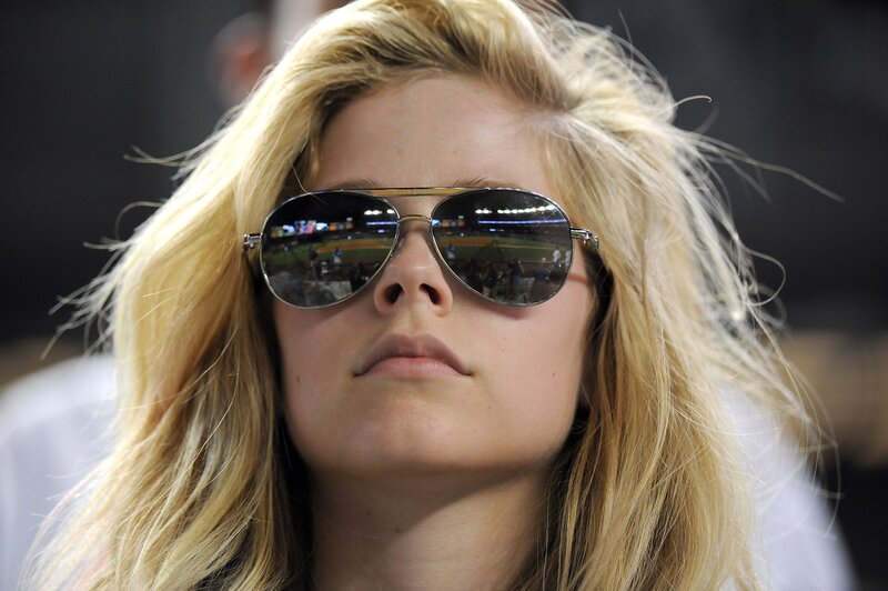 woman wearing sunglasses at stadium