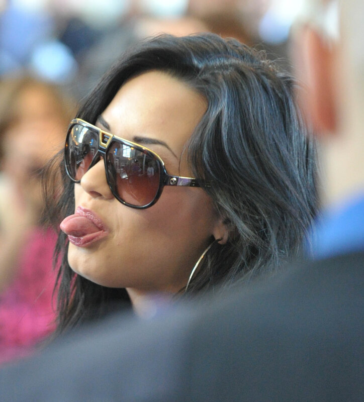 woman wearing sunglasses making a face