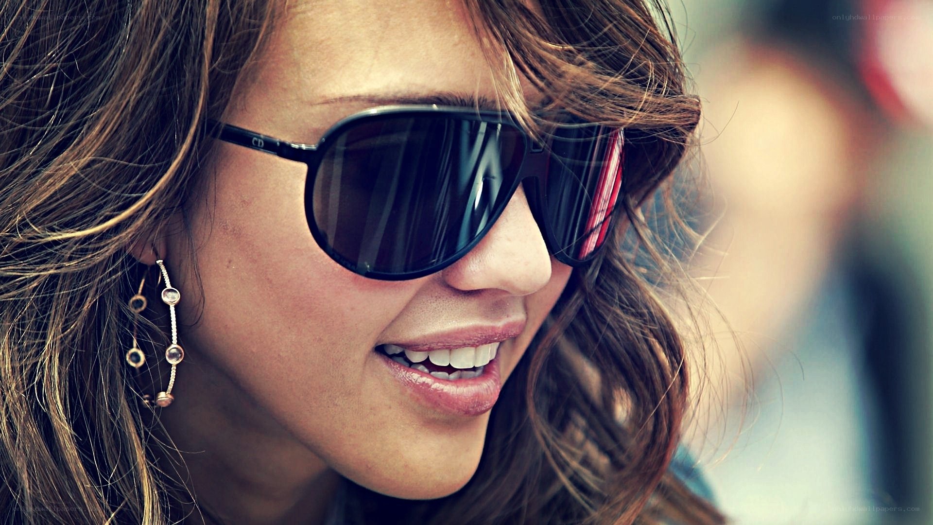 woman wearing sunglasses smiling