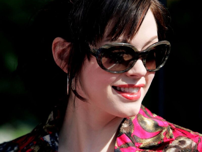 woman wearing sunglasses smiling