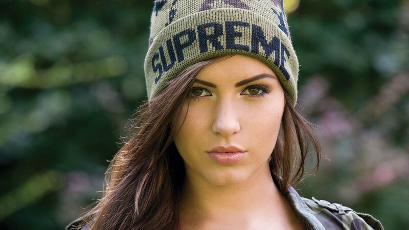 woman wearing supreme beanie