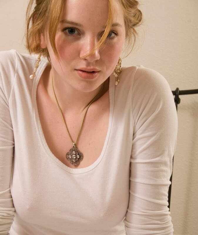 woman wearing white shirt and jewelry