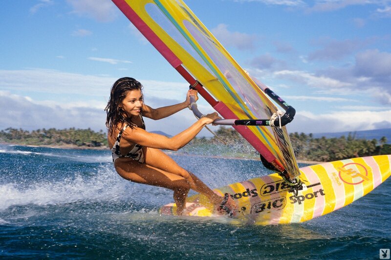 woman windsurfing on the ocean