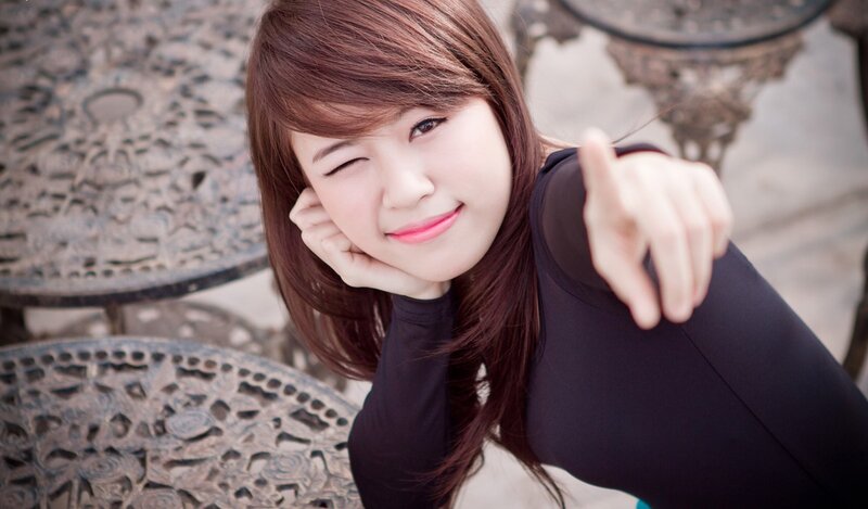 woman winking and pointing