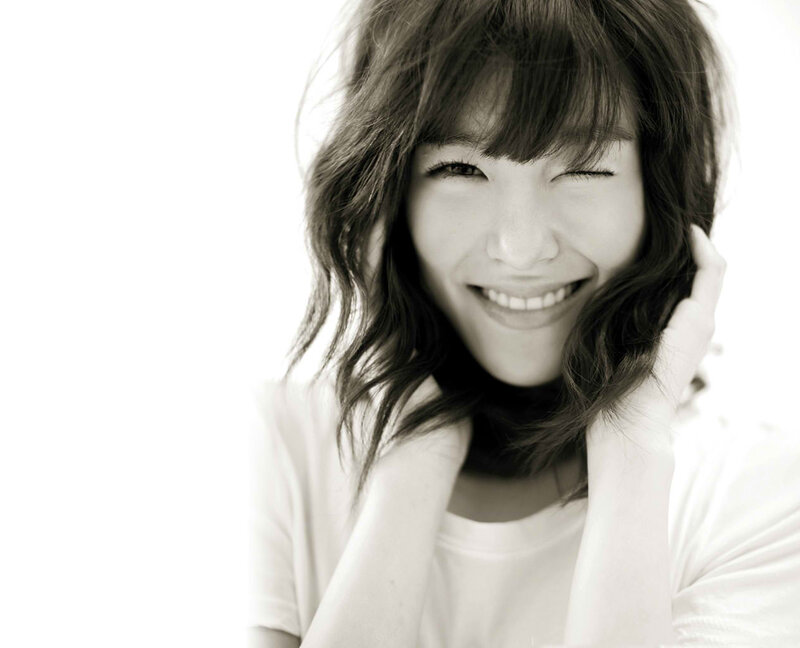 Woman Winking and Smiling — Black
