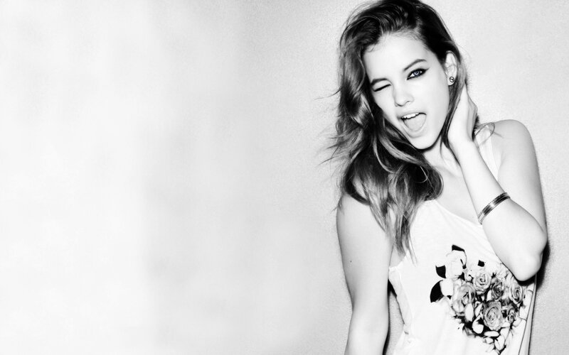 Woman Winking at Camera — Black, Playful, Photograph
