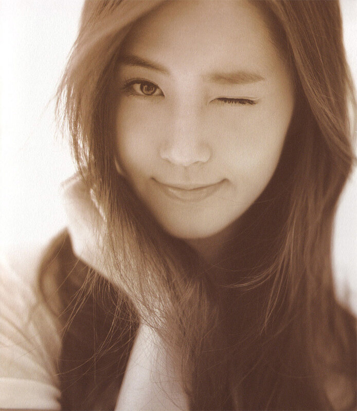 woman winking in sepia