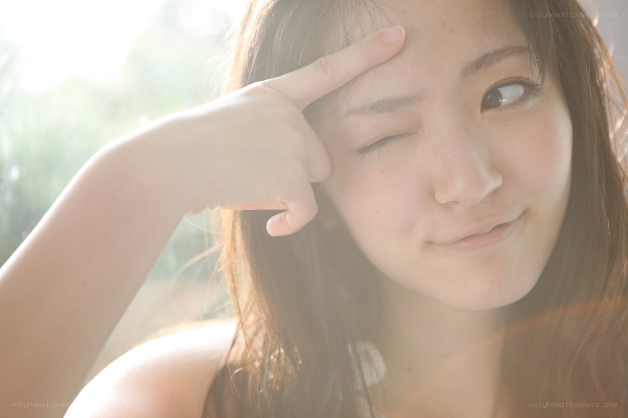 woman winking in sunlight