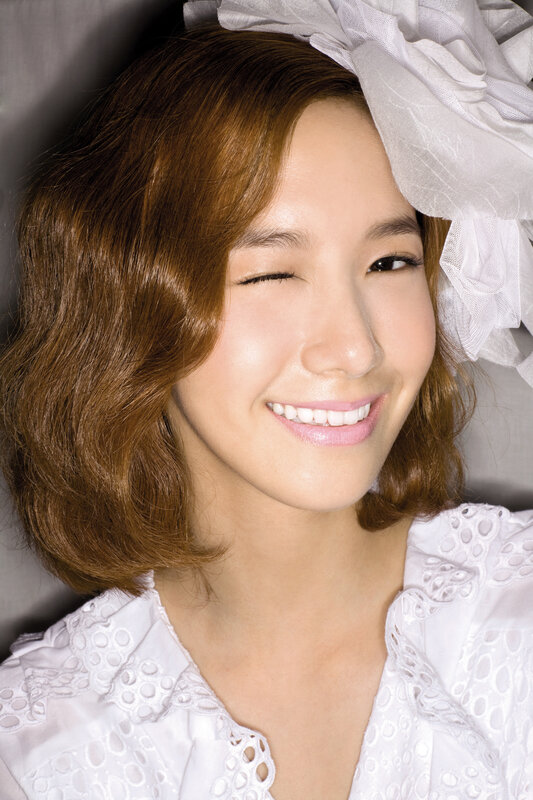 woman winking in white dress