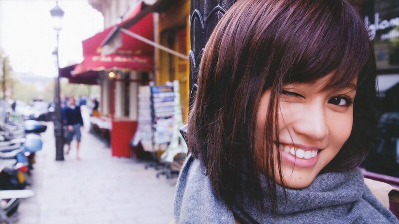 Woman Winking on Street — Gray