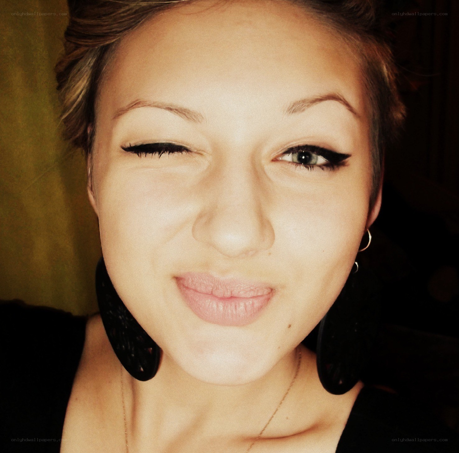 woman winking with makeup