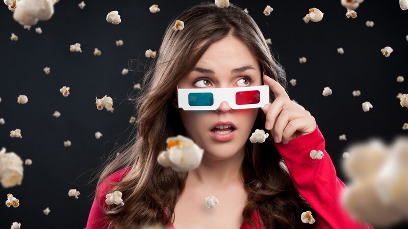 woman with 3d glasses and popcorn