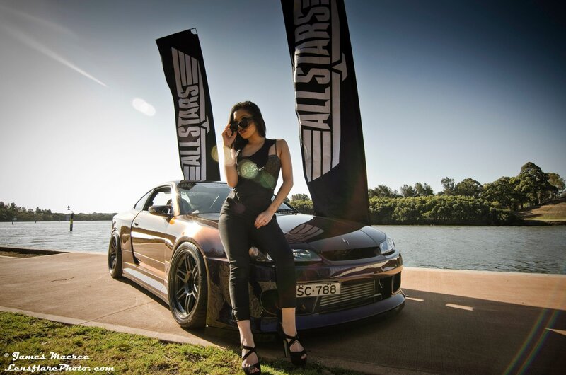 woman with a car by the water