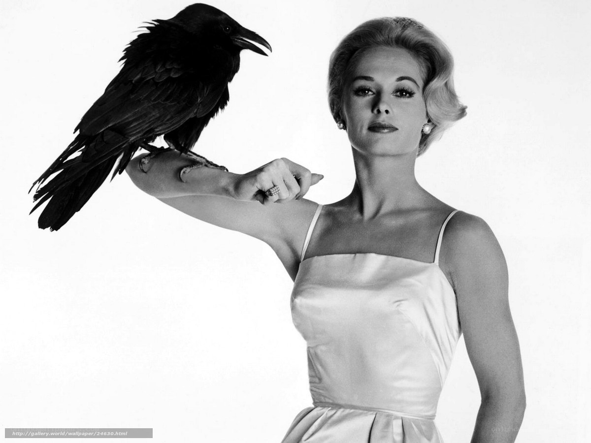 Woman with a crow on her arm