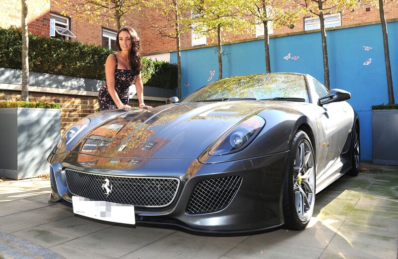 Woman with a Ferrari sports car