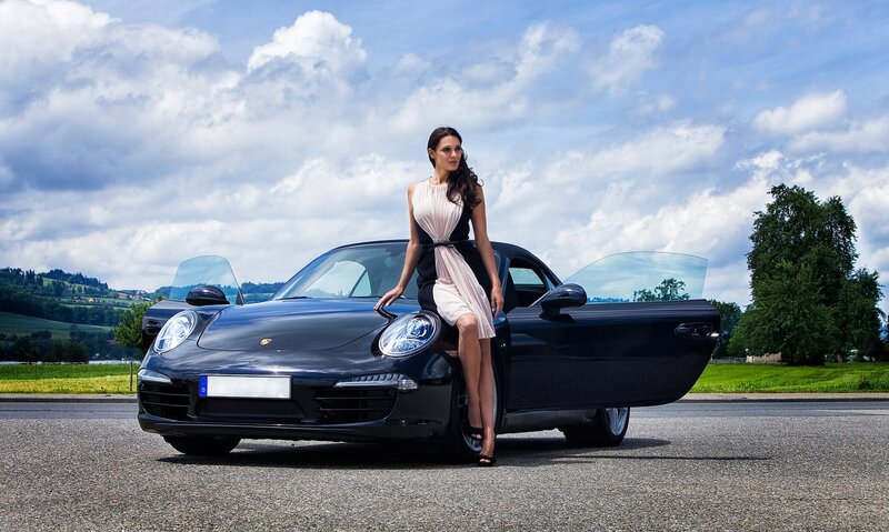Woman with a Porsche car